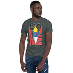 Antigua and Barbuda flag design in the words HOME on a dark heather color shirt on the front of a black man.