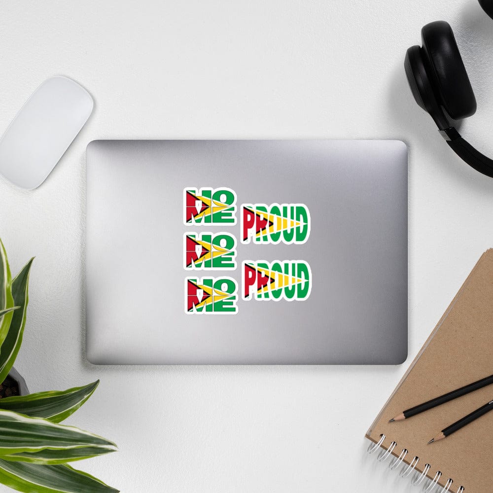 Guyana Flag stickers designed on the back of a gray laptop spelling HOME and PROUD.