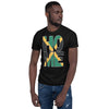 Jamaica flag design in the words HOME on a black color shirt on the front of a black man.