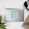 Saint Lucia Flag stickers designed on the back of a gray laptop spelling HOME and PROUD.