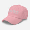 Pink classic dad hat with Soca Mode Embroidery in white.