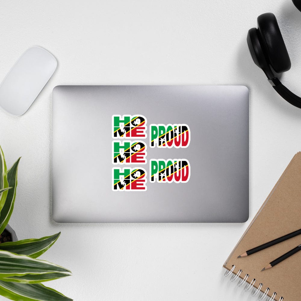 St. Kitts and Nevis Flag stickers designed on the back of a gray laptop spelling HOME and PROUD.