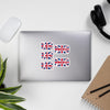 United Kingdom Flag stickers designed on the back of a gray laptop spelling HOME and PROUD.