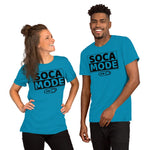 A black man and white woman wearing aqua color shirts that says Soca Mode in black print on the front.