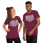 A black man and a white woman wearing maroon color shirts that says Soca Mode in white print on the front.