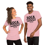 A black man and a white woman wearing pink color shirts that says Soca Mode in black print on the front.