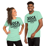 A black man and a white woman wearing heather mint color shirts that says Soca Mode in black print on the front.