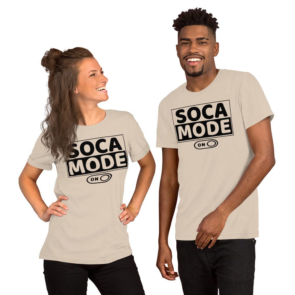 A black man and a white woman wearing soft cream color shirts that says Soca Mode in black print on the front.